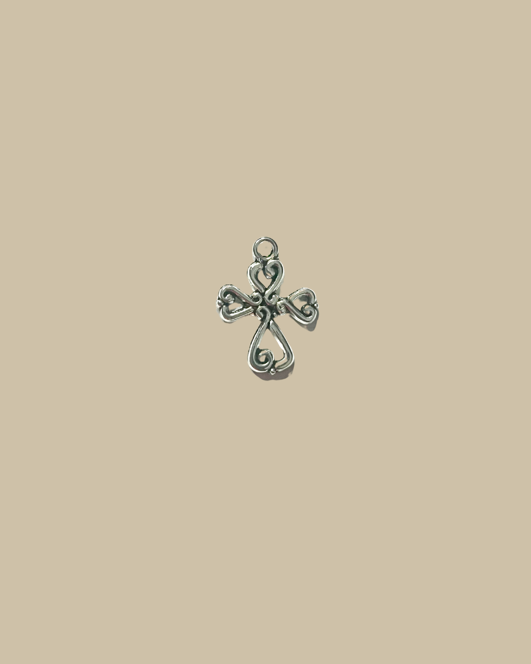 Four heart cross charm